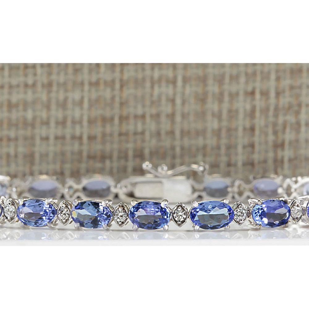 11.35 CTW Natural Tanzanite And Dimond Bracelet In 18K: 11.35 CTW Natural Tanzanite And Dimond Bracelet In 18K Solid White Gold Manufacturer's Suggested Retail Price: $ 3600.00 Stamped: 18K Bracelet Width: 4.75mm Bracelet Length: 7.0 Inches Total Bracelet 
