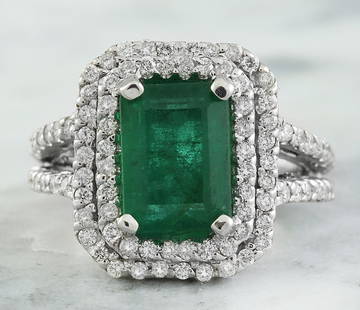2.50 CTW Emerald 18K White Gold Diamond Ring: 2.50 CTW Emerald 18K White Gold Diamond Ring Manufacturer's Suggested Retail Price: $ 4900.00 Stamped: 18K Ring Size: 7 Total Ring Weight: 7.7 Grams Emerald Weight: 1.35 Carat (9.50x7.00