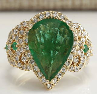 8.00 CTW Natural Emerald And Diamond Ring 14K Solid Yellow Gold: 8.00 CTW Natural Emerald And Diamond Ring 14K Solid Yellow Gold Manufacturer's Suggested Retail Price: $ 8700.00 Stamped: 14K Ring Size: 6.75 Total Ring Weight: 9.7 Grams Diamond Weight: 