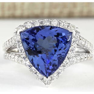 7.07 CTW Natural Blue Tanzanite And Diamond Ring 14k Solid White Gold: 7.07 CTW Natural Blue Tanzanite And Diamond Ring 14k Solid White Gold Manufacturer's Suggested Retail Price: $ 6900.00 Stamped: 14K Ring Size: 6.25 Total Ring Weight: 6.3 Grams Diamond