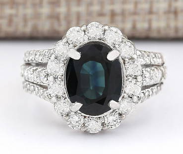 4.70 CTW Natural Blue Sapphire And Diamond Ring In 18K White Gold: 4.70 CTW Natural Blue Sapphire And Diamond Ring In 18K White Gold Manufacturer's Suggested Retail Price: $ 6000.00 Stamped: 18K Ring Size: 6.5 Total Ring Weight: 8.6 Grams Diamond Weight: 