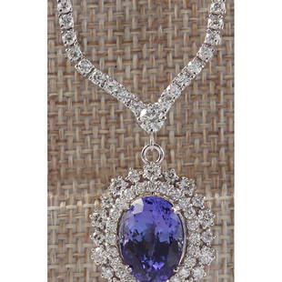 10.28CTW Natural Tanzanite And Diamond Necklace In 18K White Gold: 10.28CTW Natural Tanzanite And Diamond Necklace In 18K White Gold Manufacturer's Suggested Retail Price: $ 15400.00 Stamped: 18K Total Necklace Weight: 20.2Grams Diamond Weight: Total