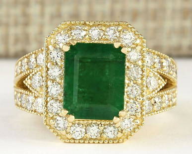 4.83 CTW Natural Emerald And Diamond Ring In 18K Yellow Gold: 4.83 CTW Natural Emerald And Diamond Ring In 18K Yellow Gold Manufacturer's Suggested Retail Price: $ 6500.00 Stamped: 18K Ring Size: 6.25 Total Ring Weight: 9.8 Grams Diamond Weight: 