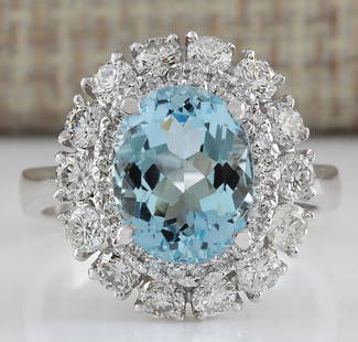 4.40 CTW Natural Aquamarine And Diamond Ring In 18K Solid White Gold: 4.40 CTW Natural Aquamarine And Diamond Ring In 18K Solid White Gold Manufacturer's Suggested Retail Price: $ 4900.00 Stamped: 18K Ring Size: 5.75 Total Ring Weight: 5.1 Grams Diamond