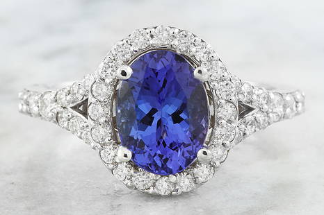 2.66 CTW Tanzanite 18K White Gold Diamond Ring: 2.66 CTW Tanzanite 18K White Gold Diamond Ring Manufacturer's Suggested Retail Price: $ 3600.00 Stamped: 18K Total Ring Weight: 3.8 Grams Tanzanite Weight 2.01 Carat (9.00x7.00 Millimeters)