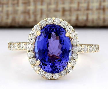 4.30 CTW Natural Tanzanite And Diamond Ring In 18K Yellow Gold: 4.30 CTW Natural Tanzanite And Diamond Ring In 18K Yellow Gold Manufacturer's Suggested Retail Price: $ 5000.00 Stamped: 18K Ring Size: 7 Total Ring Weight: 3.7 Grams Diamond Weight: 