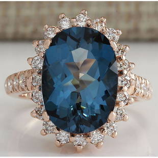 8.34 CTW Natural London Blue Topaz And Diamond Ring In 14K Solid Rose Gold: 8.34 CTW Natural London Blue Topaz And Diamond Ring In 14K Solid Rose Gold Manufacturer's Suggested Retail Price: $ 3200.00 Stamped: 14K Ring Size: 6 Total Ring Weight: 6 Grams Diamond