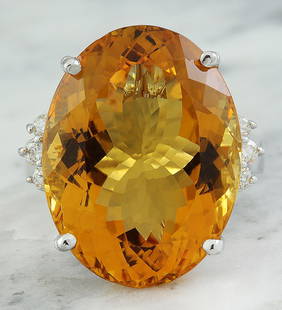 23.65 CTW Citrine 14K White Gold Diamond Ring: 23.65 CTW Citrine 14K White Gold Diamond Ring Manufacturer's Suggested Retail Price: $ 3300.00 Stamped: 14K Total Ring Weight: 11.3 Grams Citrine Weight 23.40 Carat (22.00x16.75 Millimeters)