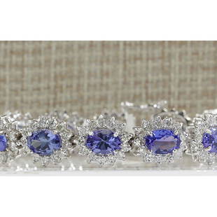 21.40 CTW Natural Tanzanite And Dimond Bracelet In 14k Solid White Gold: 21.40 CTW Natural Tanzanite And Dimond Bracelet In 14k Solid White Gold Manufacturer's Suggested Retail Price: $ 18000.00 Stamped: 14K Bracelet Width: 10.40mm Bracelet Length: 7.0 Inches 