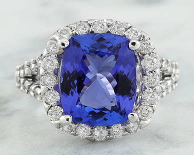 5.09 CTW Tanzanite 14K White Gold Diamond Ring: 5.09 CTW Tanzanite 14K White Gold Diamond Ring Manufacturer's Suggested Retail Price: $ 4000.00 Stamped: 14K Total Ring Weight: 5.8 Grams Tanzanite Weight: 4.00 Carat (10.80x9.00 Millimeters) 