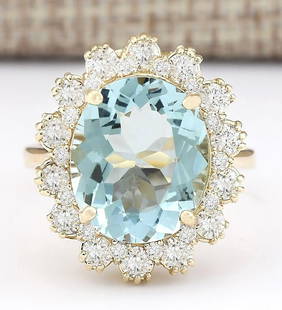 6.73 CTW Natural Blue Aquamarine And Diamond Ring In 18K Yellow Gold: 6.73 CTW Natural Blue Aquamarine And Diamond Ring In 18K Yellow Gold Manufacturer's Suggested Retail Price: $ 5100.00 Stamped: 18K Ring Size: 6.5 Total Ring Weight: 6 Grams Diamond Weight: 
