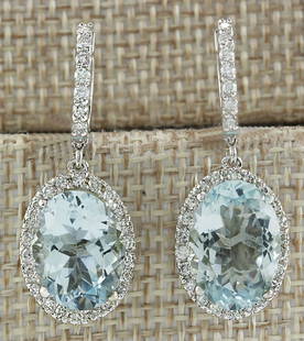 9.96 CTW Natural Aquamarine And Diamond Earrings 18K Solid White Gold: 9.96 CTW Natural Aquamarine And Diamond Earrings 18K Solid White Gold Manufacturer's Suggested Retail Price: $ 5700.00 Stamped: 18K Total Earring Weight: 8.6Grams Length: 1.26 inches Diamond