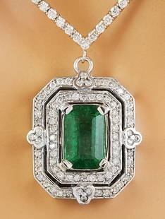 8.84 CTW Emerald 18K White Gold Diamond Necklace: 8.84 CTW Emerald 18K White Gold Diamond Necklace Manufacturer's Suggested Retail Price: $ 14900.00 Stamped: 750 Total Necklace Weight: 25.6 Grams Necklace Length: 16.5 Inches Emerald Weight:
