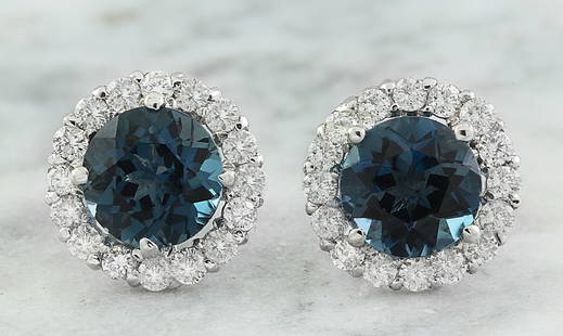 3.65 CTW Topaz 14K White Gold Diamond Earrings: 3.65 CTW Topaz 14K White Gold Diamond Earrings Manufacturer's Suggested Retail Price: $ 2100.00 Stamped: 14K Total Earrings Weight: 1.5 Grams Topaz Weight: 3.00 Carat (7.00x7.00 Millimeters) 