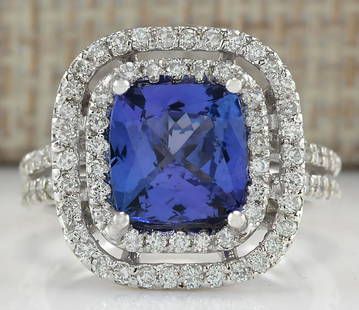 3.93 CTW Natural Blue Tanzanite And Diamond Ring In 14K Solid White Gold: 3.93 CTW Natural Blue Tanzanite And Diamond Ring In 14K Solid White Gold Manufacturer's Suggested Retail Price: $ 5100.00 Stamped: 14K Ring Size: 6 Total Ring Weight: 6.5 Grams Diamond