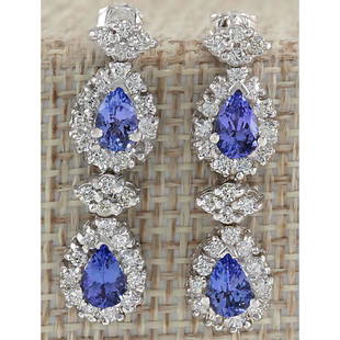 3.16 CTW Natural Blue Tanzanite And Diamond Earrings In 14K White Gold: 3.16 CTW Natural Blue Tanzanite And Diamond Earrings In 14K White Gold Manufacturer's Suggested Retail Price: $ 4100.00 Stamped: 14K Length: 11.20 inch Total Ring Weight: 6.7 Grams Diamond