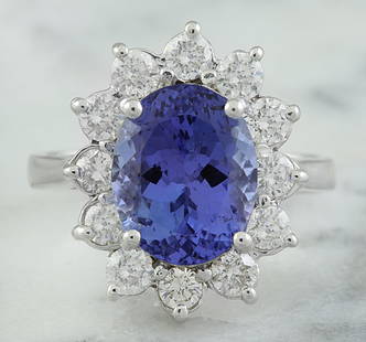 4.74 CTW Tanzanite 18K White Gold Diamond Ring: 4.74 CTW Tanzanite 18K White Gold Diamond Ring Manufacturer's Suggested Retail Price: $ 5700.00 Stamped: 18K Total Ring Weight: 6.1 Grams Tanzanite Weight: 3.74 Carat (12.00x8.00 Millimeters) 