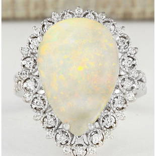 4.93 CTW Natural Opal And Diamond Ring In18K White Gold: 4.93 CTW Natural Opal And Diamond Ring In18K White Gold Manufacturer's Suggested Retail Price: $ 4000.00 Stamped: 18K Ring Size: 7 Total Ring Weight: 7.2 Grams Diamond Weight: Total