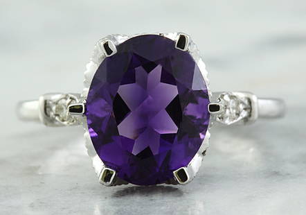 3.41 CTW Amethyst 18K White Gold Diamond Ring: 3.41 CTW Amethyst 18K White Gold Diamond Ring Manufacturer's Suggested Retail Price: $ 2100.00 Stamped: 18K Total Ring Weight: 4.2 Grams Amethyst Weight: 3.26 Carat (11.00x9.00 Millimeters) 