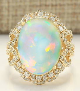 7.75 CTW Natural Opal And Diamond Ring In 14k Yellow Gold: 7.75 CTW Natural Opal And Diamond Ring In 14k Yellow Gold Manufacturer's Suggested Retail Price: $ 5100.00 Stamped: 14K Ring Size: 7.25 Total Ring Weight: 7 Grams Diamond Weight: Total