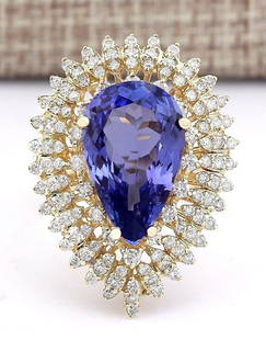 8.10 CTW Natural Tanzanite And Diamond Ring In 18K Yellow Gold: 8.10 CTW Natural Tanzanite And Diamond Ring In 18K Yellow Gold Manufacturer's Suggested Retail Price: $ 8900.00 Stamped: 18K Ring Size: 7.25 Total Ring Weight: 10 Grams Diamond Weight: 