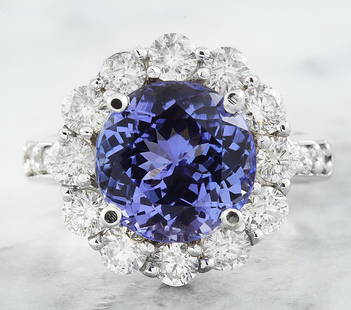 3.64 CTW Tanzanite 14K White Gold Diamond Ring: 3.64 CTW Tanzanite 14K White Gold Diamond Ring Manufacturer's Suggested Retail Price: $ 6700.00 Stamped: 14K Total Ring Weight: 6.5 Grams Tanzanite Weight 5.20 Carat (10.40x10.40 Millimeters)