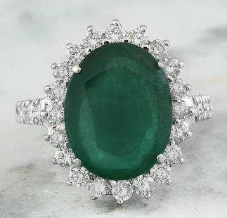 9.30 CTW Emerald 18K White Gold Diamond Ring: 9.30 CTW Emerald 18K White Gold Diamond Ring Manufacturer's Suggested Retail Price: $ 8400.00 Stamped: 18K Total Ring Weight: 7.2 Grams Emerald Weight 8.05 Carat (14.00x11.00 Millimeters)