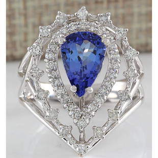 2.74 CTW Natural Blue Tanzanite And Diamond Ring 18K Solid White Gold: 2.74 CTW Natural Blue Tanzanite And Diamond Ring 18K Solid White Gold Manufacturer's Suggested Retail Price: $ 4400.00 Stamped: 18K Ring Size: 7 Total Ring Weight: 6.5 Grams Diamond Weight: 