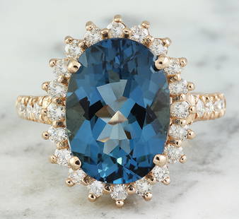 8.35 CTW Topaz 18K Rose Gold Diamond Ring: 8.35 CTW Topaz 18K Rose Gold Diamond Ring Manufacturer's Suggested Retail Price: $ 3400.00 Stamped: 18K Total Ring Weight: 6 Grams Topaz Weight 7.35 Carat (14.00x10.00 Millimeters) Diamond