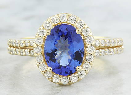 2.34 CTW Tanzanite 18K Yellow Gold Diamond Ring: 2.34 CTW Tanzanite 18K Yellow Gold Diamond Ring Manufacturer's Suggested Retail Price: $ 3400.00 Stamped: 18K Total Ring Weight: 4.9 Grams Tanzanite Weight 1.84 Carat ( 9.00x7.00 Millimeters)