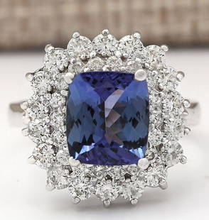 4.56 CTW Natural Blue Tanzanite And Diamond Ring 14k Solid White Gold: 4.56 CTW Natural Blue Tanzanite And Diamond Ring 14k Solid White Gold Manufacturer's Suggested Retail Price: $ 5100.00 Stamped: 14K Ring Size: 6.75 Total Ring Weight: 6.4 Grams Diamond