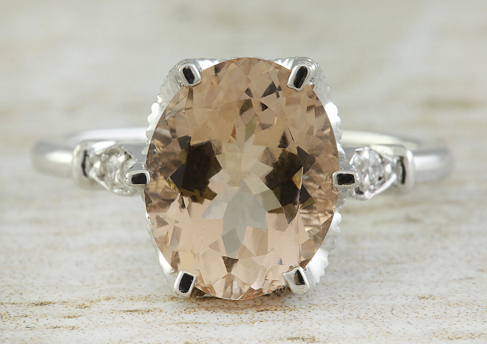 3.41 CTW Morganite 14K White Gold Diamond Ring: 3.41 CTW Morganite 14K White Gold Diamond Ring Manufacturer's Suggested Retail Price: $ 2400.00 Stamped: 14K Total Ring Weight: 4.2 Grams Morganite Weight: 3.26 Carat (11.00x9.00 Millimeters) Diamond 