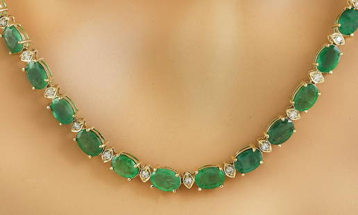 34.65 CTW Emerald 14K Yellow Gold Diamond Necklace: 34.65 CTW Emerald 14K Yellow Gold Diamond Necklace Manufacturer's Suggested Retail Price: $ 9000.00 Stamped: 14K Total Necklace Weight: 21 Grams Necklace Length: 18.5 Inches Emerald Weight: