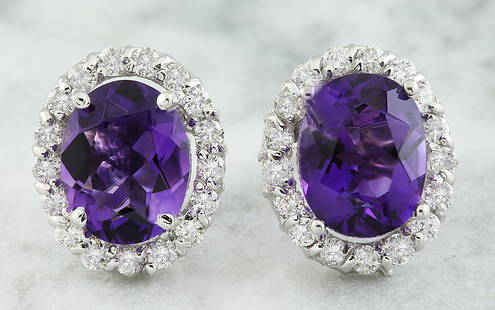 3.79 CTW Amethyst 14K White Gold Diamond Earrings: 3.79 CTW Amethyst 14K White Gold Diamond Earrings Manufacturer's Suggested Retail Price: $ 2600.00 Stamped: 14K Total Earrings Weight: 2.8 Grams Amethyst Weight: 3.09 Carat (9.00x7.00