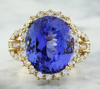 20.15 CTW Tanzanite 14K Yellow Gold Diamond Ring: 20.15 CTW Tanzanite 14K Yellow Gold Diamond Ring Manufacturer's Suggested Retail Price: $ 14900.00 Stamped: 14K Total Ring Weight: 9.8 Grams Tanzanite Weight: 18.80 Carat (14.80x12.60