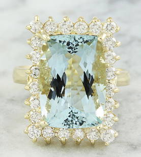 9.35 CTW Aquamarine 18K Yellow Gold Diamond Ring: 9.35 CTW Aquamarine 18K Yellow Gold Diamond Ring Manufacturer's Suggested Retail Price: $ 5000.00 Stamped: 18K Total Ring Weight: 7.8 Grams Aquamarine Weight 8.20 Carat ( 15.00x10.50