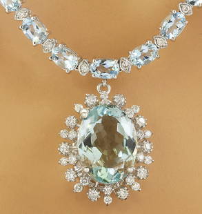 39.80 CTW Aquamarine 14K White Gold Diamond Necklace: 39.80 CTW Aquamarine 14K White Gold Diamond Necklace Manufacturer's Suggested Retail Price: $ 11900.00 Stamped: 14K Total Necklace Weight: 28.3 Grams Necklace Length: 18 Inches Center Aquamarine