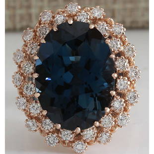 14.31 CTW Natural London Blue Topaz And Diamond Ring 18K Solid Rose Gold: 14.31 CTW Natural London Blue Topaz And Diamond Ring 18K Solid Rose Gold Manufacturer's Suggested Retail Price: $ 4300.00 Stamped: 18K Ring Size: 7 Total Ring Weight: 9 Grams Diamond Weight: