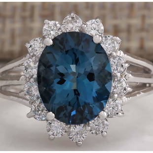 4.37CTW Natural London Blue Topaz And Diamond Ring In14K Solid White Gold: 4.37CTW Natural London Blue Topaz And Diamond Ring In14K Solid White Gold Manufacturer's Suggested Retail Price: $ 2900.00 Stamped: 14K Ring Size: 6.5 Total Ring Weight: 4.1 Grams Diamond