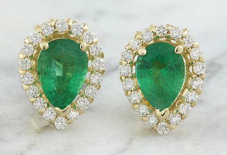 1.45 CTW Emerald 18K yellow Gold Diamond Earrings: 1.45 CTW Emerald 18K yellow Gold Diamond Earrings Manufacturer's Suggested Retail Price: $ 2100.00 Stamped: 18K Total Earrings Weight: 1.3 Grams Emerald Weight: 1.15 Carat (7.50x4.90