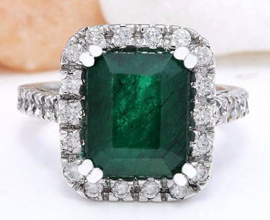 5.82 CTW Natural Emerald 18K Solid White Gold Diamond Ring: 5.82 CTW Natural Emerald 18K Solid White Gold Diamond Ring Manufacturer's Suggested Retail Price: $ 5700.00 5.82 Carat Natural Emerald 18K Solid White Gold Diamond Ring Item Type: Ring Item