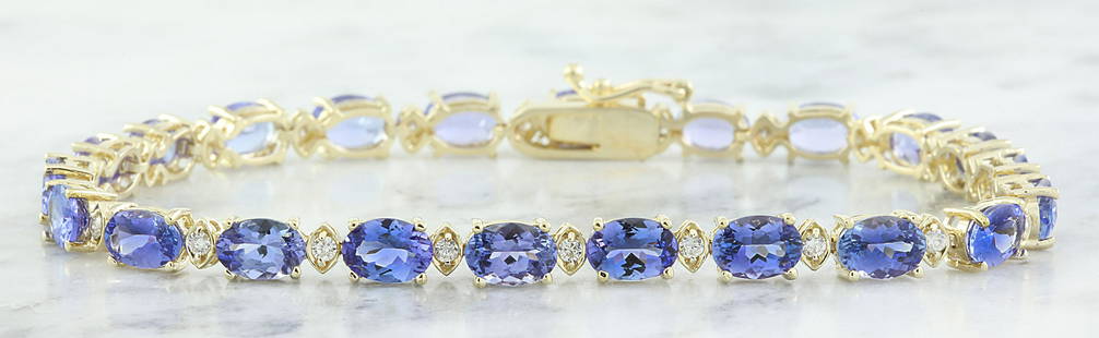 13.45 CTW Tanzanite 14K Yellow Gold Diamond Bracelet: 13.45 CTW Tanzanite 14K Yellow Gold Diamond Bracelet Manufacturer's Suggested Retail Price: $ 3300.00 Stamped: 14K Total Bracelet Weight: 8.8 Grams Bracelet Length: 7 Inches Tanzanite Weight: