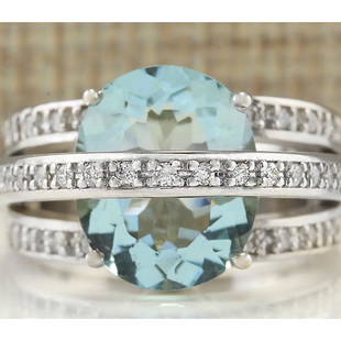 6.40 CTW Natural Aquamarine And Diamond Ring In 18K White Gold: 6.40 CTW Natural Aquamarine And Diamond Ring In 18K White Gold Manufacturer's Suggested Retail Price: $ 5100.00 Stamped: 18K Ring Size: 6.75 Total Ring Weight: 13 Grams Diamond Weight: 