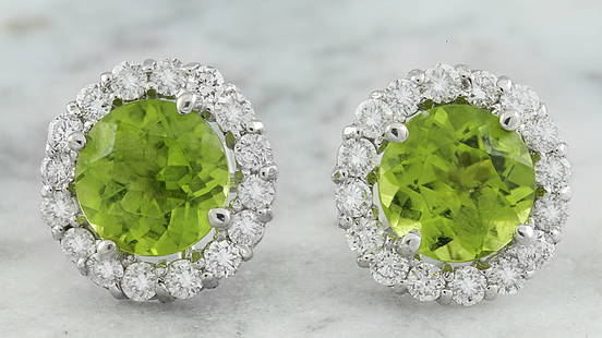 3.65 CTW Peridot 18K White Gold Diamond Earrings: 3.65 CTW Peridot 18K White Gold Diamond Earrings Manufacturer's Suggested Retail Price: $ 2800.00 Stamped: 18K Total Earrings Weight: 1.5 Grams Peridot Weight: 3.00 Carat (7.00x7.00