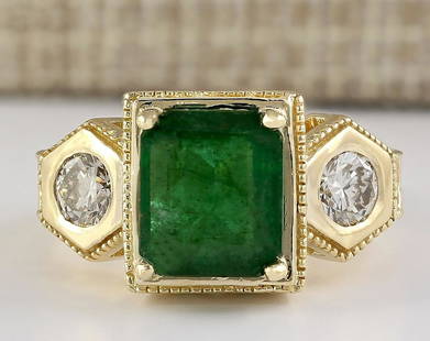 4.68 CTW Natural Emerald And Diamond Ring In 14k Yellow Gold: 4.68 CTW Natural Emerald And Diamond Ring In 14k Yellow Gold Manufacturer's Suggested Retail Price: $ 9200.00 Stamped: 14K Ring Size: 6.75 Total Ring Weight: 11.4 Grams Diamond Weight: 