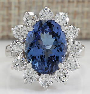 6.35 CTW Natural Blue Tanzanite And Diamond Ring In 18K White Gold: 6.35 CTW Natural Blue Tanzanite And Diamond Ring In 18K White Gold Manufacturer's Suggested Retail Price: $ 7900.00 Stamped: 18K Ring Size: 6 Total Ring Weight: 5 Grams Diamond Weight: 