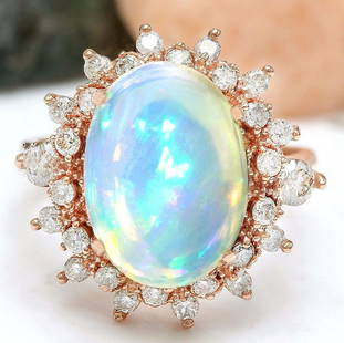 4.95 CTW Natural Opal 18K Solid Rose Gold Diamond Ring: 4.95 CTW Natural Opal 18K Solid Rose Gold Diamond Ring Manufacturer's Suggested Retail Price: $ 3400.00 4.95 Carat Natural Opal 18K Solid Rose Gold Diamond Ring Item Type: Ring Item Style: