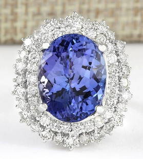 12.86 CTW Natural Blue Tanzanite And Diamond Ring 14k Solid White Gold: 12.86 CTW Natural Blue Tanzanite And Diamond Ring 14k Solid White Gold Manufacturer's Suggested Retail Price: $ 11100.00 Stamped: 14K Ring Size: 5.75 Total Ring Weight: 8.9 Grams Diamond