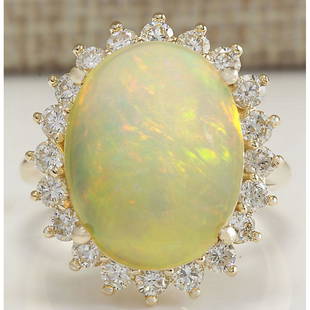 10.46 CTW Natural Opal And Diamond Ring In 14K Solid Yellow Gold: 10.46 CTW Natural Opal And Diamond Ring In 14K Solid Yellow Gold Manufacturer's Suggested Retail Price: $ 5500.00 Stamped: 14K Ring Size: 6.5 Total Ring Weight: 8.3 Grams Diamond Weight: 