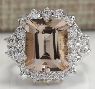 7.04 CTW Natural Morganite And Diamond Ring 14K Solid White Gold: 7.04 CTW Natural Morganite And Diamond Ring 14K Solid White Gold Manufacturer's Suggested Retail Price: $ 5300.00 Stamped: 14K Ring Size: 6 Total Ring Weight: 7.5 Grams Diamond Weight: 